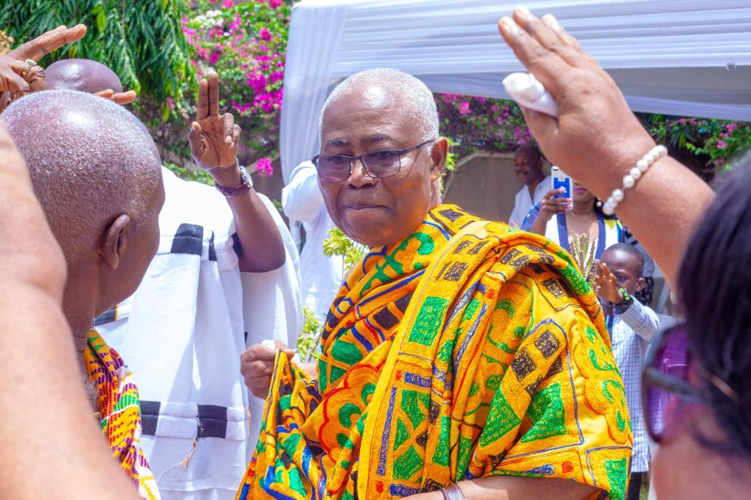 At ceremony in golden Kente