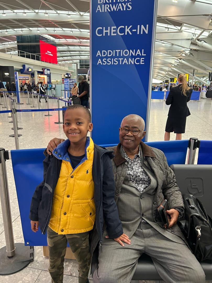 With grandson at airport